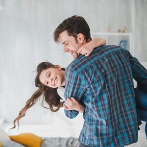 father playing with daughter
