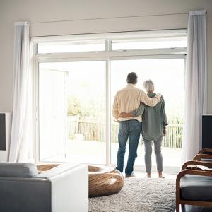 retired couple looking out window