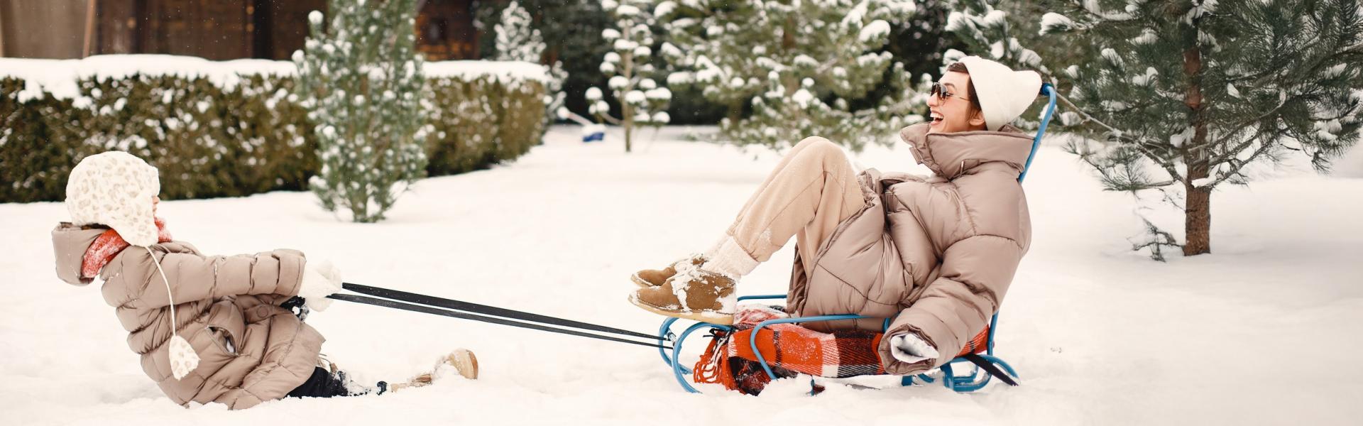 mom and child playing in snow